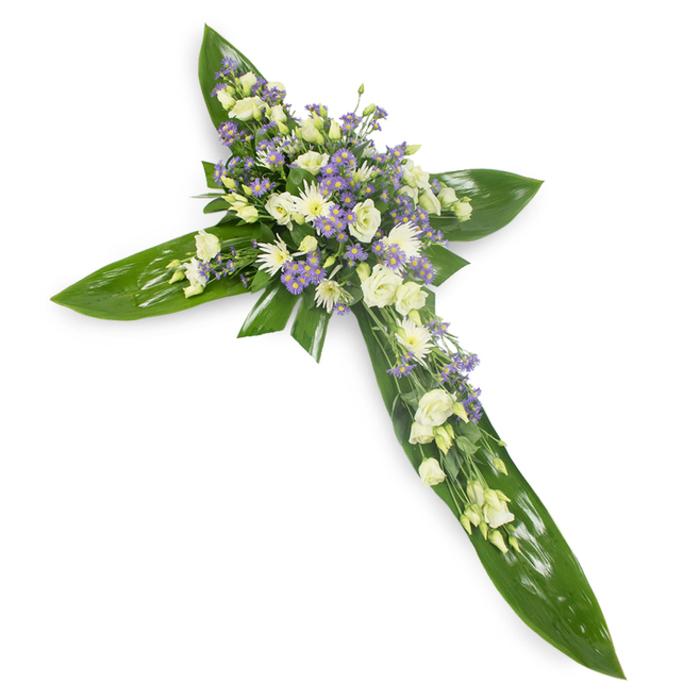 A carefully crafted sympathy cross photographed from a slight overhead viewpoint against a plain white backdrop, designed to read with immediate clarity and quiet dignity. Large, lustrous green leaves - the kind used by florists for strong, tropical structure - are arranged to form the cross's spine and arms, their smooth surfaces and visible midribs creating a bold, protective silhouette. Nestled along the central axis and at the intersection, clusters of soft, creamy lisianthus unfurl in layered, ruffled petals, their pale warmth balanced by neat, white daisy-like chrysanthemums that add bright, textural points throughout the grouping. Interspersed among these are sprays of delicate, light-lilac flowers, likely limonium or small asters, whose tiny blooms introduce a gentle wash of lavender that deepens the arrangement's emotional resonance without overpowering its serenity. Thin bits of finer foliage thread through the blossoms, providing subtle contrast and natural depth. The lighting is even and soft, allowing the gloss of the leaves and the tender translucence of the petals to register clearly, as if the morning sun were diffused through chapel windows. This piece reads as a composed expression of remembrance - a visual prayer of calm - suitable for a funeral service in Harold Wood or delivery to a family home in nearby Gidea Park. The tactile contrasts - the waxy leaf against the soft petals - and the understated scent of green foliage and pale flowers complete the impression of respectful, handcrafted sympathy.