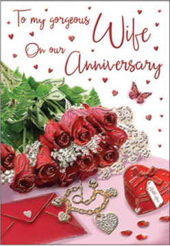 This anniversary image resembles a love letter laid out on a Harold Wood sideboard, bathed in mellow daylight filtering in from a nearby window. A small posy of crimson roses dominates the scene, their swirling petals richly layered and almost velvety to the eye. The blooms feel luxurious and near to touch, nestled among lively shoots of greenery that frame them with a sense of freshness and movement. The flowers seem poised to spill from the edge of the card, echoing the look of a hand-tied arrangement that has just arrived from a trusted florist near Harold Wood station. Around the roses, exquisite touches of romance are carefully composed: a scarlet jewellery box bound with soft ribbon, a golden necklace forming entwined hearts, and a scattering of sparkling decorations that glimmer like captured starlight. The softly scripted text on the card floats amid a cascade of tiny red hearts, drawing the gaze along its curves, as if following whispered words of devotion. Gentle lighting washes over the composition, picking up the gleam of metal, the subtle gloss of the card, and the velvety depth of each petal. The entire scene feels intimate and cherished, like a moment caught just before an anniversary supper at home near Ardleigh Green or along the quieter streets leading towards Harold Wood Park. It speaks of shared futures, special dates remembered, and gestures of affection that never go out of style. The image invites the viewer to imagine the faint fragrance of the roses and the soft clink of jewellery being lifted from the box-a tribute to enduring commitment.