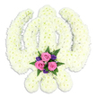A refined Sikh Khanda floral arrangement stands out clearly against a pure white studio background, the entire emblem composed of countless small white chrysanthemums placed with extraordinary care. The central double-edged sword rises vertically, its outline softened yet perfectly readable thanks to the smooth run of petals, while the chakkar forms a flawless circle around it, and the two elegant kirpans curve outward to create the familiar Khanda silhouette. The chrysanthemums' feathery petals and gentle cream-white hue give the tribute a soft, tranquil appearance, as though it has been freshly prepared for a Sikh memorial service in Harold Wood or the neighbouring streets. At the base of the symbol, neatly framed between the curves of the kirpans, a cluster of accent flowers introduces a tender splash of colour. Three fresh pink roses open towards the viewer, their velvety petals layered in tight spirals, surrounded by smaller blossoms in deep purple tones and lush dark green foliage, including delicate fern fronds that fan out slightly. This subtle play of colour against the white body of the Khanda adds emotional depth, suggesting affection, remembrance, and the gentle support of the community. The lighting is soft and even, with a faint shadow falling beneath the arrangement that lends it dimension and the feeling that it could be set on an easel at a Harold Wood chapel or gurdwara entrance. The overall impression is one of dignity and peace, reflecting the thoughtful work of local florists who understand both the visual form and spiritual meaning of the Khanda, creating a floral tribute that honours faith, courage, and the enduring bond between the departed and their loved ones.